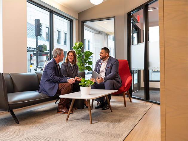 Banker at desk with a client